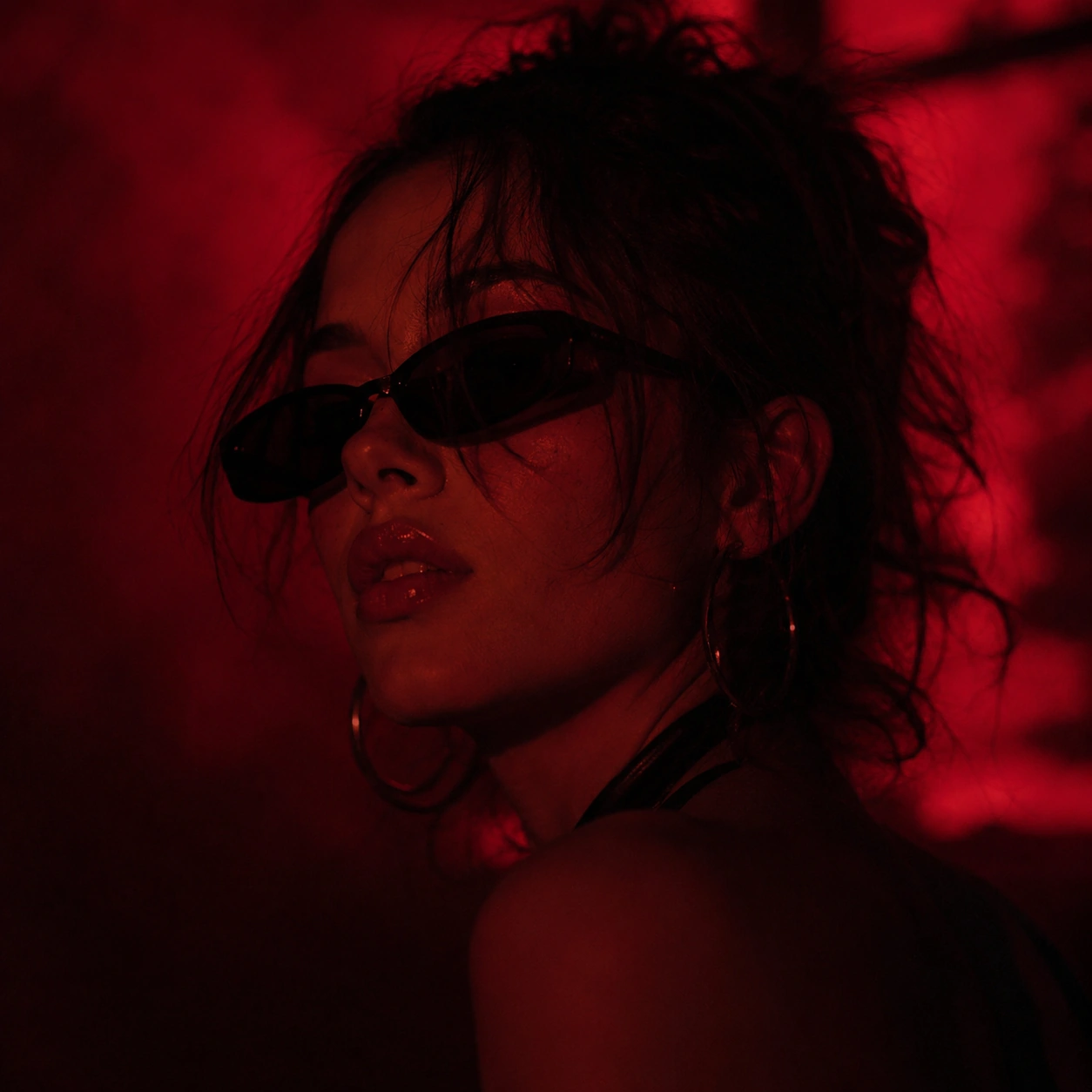 Close-up portrait of MIXXIE in red light